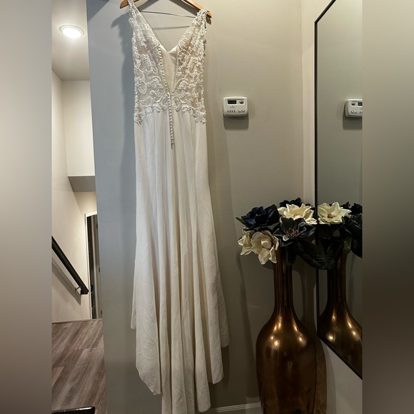 Demetrios Bridal Gown
Color: Ivory Size:10
button covered zipper back - Picture 6 of 6